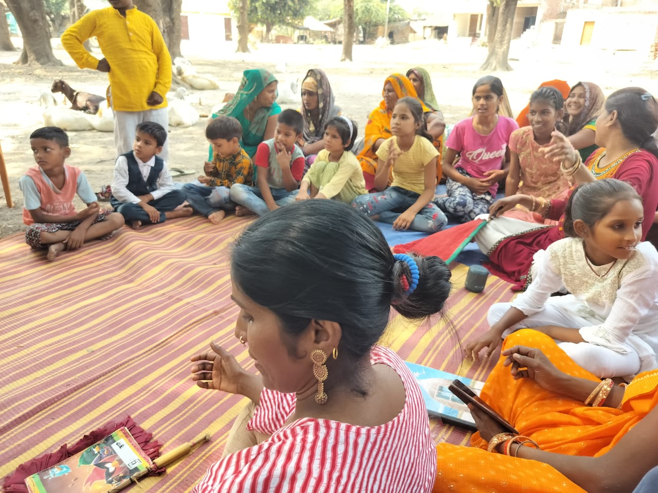 Children and community members taking part in an outdoor session