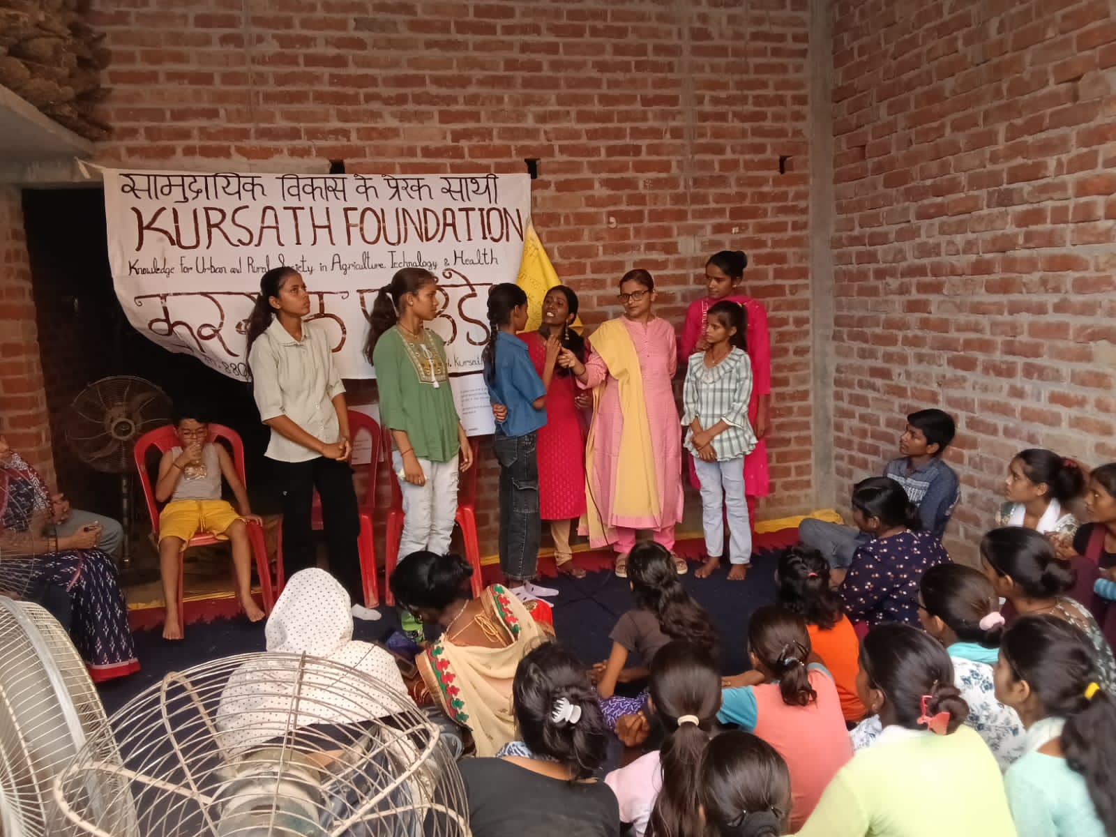 Girls participating in a community learning session